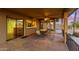Covered outdoor patio features desert views, an outdoor dining area, and access to the kitchen at 8752 E Range Rider Trl, Mesa, AZ 85207