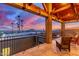 Wide covered patio with open architecture to appreciate Arizona sunset views from the comfortable seating at 8752 E Range Rider Trl, Mesa, AZ 85207