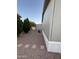 The backyard with gravel, pavers and various trees at 8832 E Pueblo Ave # 20, Mesa, AZ 85208