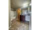 Well-lit bathroom features a shower/tub combo, wood vanity, and tile flooring at 8832 E Pueblo Ave # 20, Mesa, AZ 85208