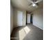 Bedroom with tan walls, carpet flooring, a ceiling fan, and closet at 8832 E Pueblo Ave # 20, Mesa, AZ 85208