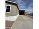 Exterior shot of a home with a driveway and an attached carport at 8832 E Pueblo Ave # 20, Mesa, AZ 85208
