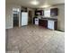 Open kitchen space with tile floors, white appliances, and dark wood cabinetry at 8832 E Pueblo Ave # 20, Mesa, AZ 85208