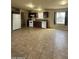 An open concept kitchen featuring tile floors, dark cabinets and white appliances at 8832 E Pueblo Ave # 20, Mesa, AZ 85208