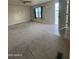 Expansive living room with lots of light, carpet flooring, and tile near the door at 8832 E Pueblo Ave # 20, Mesa, AZ 85208