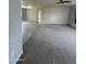 Spacious living room showcasing neutral-toned walls with carpet and tile flooring at 8832 E Pueblo Ave # 20, Mesa, AZ 85208