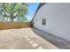 Backyard featuring a block wall, partial green grass, and a dirt area with stepping stones at 8942 W Peck Dr, Glendale, AZ 85305