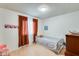 Cozy bedroom with hardwood floors, cheerful decor, and warm natural light at 8942 W Peck Dr, Glendale, AZ 85305