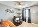 Comfortable bedroom featuring hardwood floors, a ceiling fan, and ample natural light at 8942 W Peck Dr, Glendale, AZ 85305