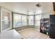 Cozy breakfast nook featuring large windows, tile flooring, and natural light at 8942 W Peck Dr, Glendale, AZ 85305