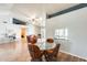 Bright dining area next to the kitchen, with a glass table and seating for four at 8942 W Peck Dr, Glendale, AZ 85305