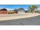 Exterior view of a well-maintained home with a three-car garage and low-maintenance landscaping at 8942 W Peck Dr, Glendale, AZ 85305