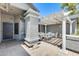 Covered front patio with textured columns and pergola and seating area at 8942 W Peck Dr, Glendale, AZ 85305
