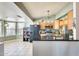 Open concept kitchen featuring granite countertops, oak cabinets, and stainless steel appliances at 8942 W Peck Dr, Glendale, AZ 85305