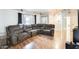 Cozy living room with hardwood floors, comfortable seating, and ample natural light at 8942 W Peck Dr, Glendale, AZ 85305