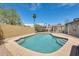 Sparkling backyard pool area with a fenced surround and a sunny patio area at 8942 W Peck Dr, Glendale, AZ 85305