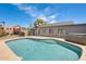 Private backyard with a sparkling pool, hot tub, and fenced-in area, ideal for relaxation at 8942 W Peck Dr, Glendale, AZ 85305