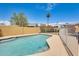 Sparkling backyard pool area with a fenced surround and a sunny patio area at 8942 W Peck Dr, Glendale, AZ 85305