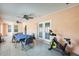 Open sunroom with exercise equipment and dining area, perfect for relaxation at 8942 W Peck Dr, Glendale, AZ 85305