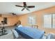 Spacious sunroom with ceiling fans, windows, and dining area at 8942 W Peck Dr, Glendale, AZ 85305