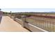 Spacious backyard with an elevated patio area and serene landscape views at 9548 W Keyser Dr, Peoria, AZ 85383