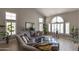 Bright living room with vaulted ceilings, lots of natural light, and stylish contemporary decor at 9548 W Keyser Dr, Peoria, AZ 85383
