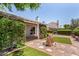 Serene backyard with lush greenery and a charming fountain feature at 9636 N 53Rd Ave, Glendale, AZ 85302