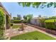 Landscaped backyard with a fountain and well-maintained artificial turf at 9636 N 53Rd Ave, Glendale, AZ 85302