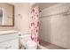 Bathroom featuring a shower, toilet, and wood mirror at 9636 N 53Rd Ave, Glendale, AZ 85302