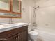 Well-maintained bathroom with tub-shower, vanity with storage, and white tile at 9636 N 53Rd Ave, Glendale, AZ 85302