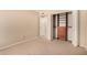 Bright bedroom featuring a walk-in closet and neutral carpeting at 9636 N 53Rd Ave, Glendale, AZ 85302