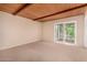 Bedroom with wood ceiling and sliding doors leading to patio at 9636 N 53Rd Ave, Glendale, AZ 85302