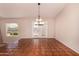 Open dining room with terracotta floors and a chandelier at 9636 N 53Rd Ave, Glendale, AZ 85302