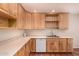 Well-appointed kitchen with plenty of counter space and natural wood cabinets at 9636 N 53Rd Ave, Glendale, AZ 85302