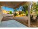 A covered backyard patio, providing a relaxing outdoor space with a beautiful view at 10735 W Bermuda Dr, Avondale, AZ 85392