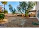 Backyard featuring patio, lush greenery, and ample space for outdoor entertaining and relaxation at 10735 W Bermuda Dr, Avondale, AZ 85392