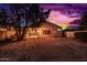 Inviting backyard with patio perfect for evening relaxation under beautiful sunset skies at 10735 W Bermuda Dr, Avondale, AZ 85392