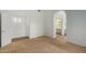 A simple bedroom with carpet, window, and baseboard with white wall and closet at 10735 W Bermuda Dr, Avondale, AZ 85392