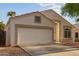 Charming single-story home features a two-car garage, neutral stucco, and desert landscaping at 10735 W Bermuda Dr, Avondale, AZ 85392
