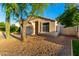 Inviting single-story home with desert landscaping, a two-car garage and a well-maintained yard at 10735 W Bermuda Dr, Avondale, AZ 85392