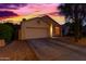 Lovely single-story home featuring a two-car garage and low-maintenance desert landscaping at 10735 W Bermuda Dr, Avondale, AZ 85392