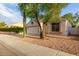 Charming single-story home with a two-car garage and low-maintenance desert landscaping at 10735 W Bermuda Dr, Avondale, AZ 85392