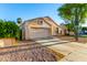 Well-maintained single-story home featuring desert landscaping, a two-car garage and a clean driveway at 10735 W Bermuda Dr, Avondale, AZ 85392