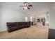 Open floor plan with living room flowing into the kitchen, complemented by cozy seating at 10735 W Bermuda Dr, Avondale, AZ 85392