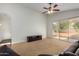Spacious living room featuring neutral carpet and access to the backyard through sliding glass doors at 10735 W Bermuda Dr, Avondale, AZ 85392