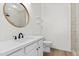 Updated bathroom with round mirror, modern vanity and walk-in shower at 1225 N 36Th St # 1015, Phoenix, AZ 85008