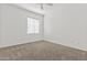 Neutral bedroom with tan carpet, double-paned windows and ceiling fan at 1225 N 36Th St # 1015, Phoenix, AZ 85008