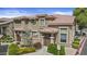 Inviting townhome with a well-manicured lawn, gated entryway, and clay tile roof at 1225 N 36Th St # 1015, Phoenix, AZ 85008
