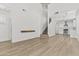 Spacious living room with hardwood floors and a contemporary floating shelf at 1225 N 36Th St # 1015, Phoenix, AZ 85008