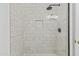 Updated walk-in shower with white subway tile, glass door and rainfall shower head at 1225 N 36Th St # 1015, Phoenix, AZ 85008